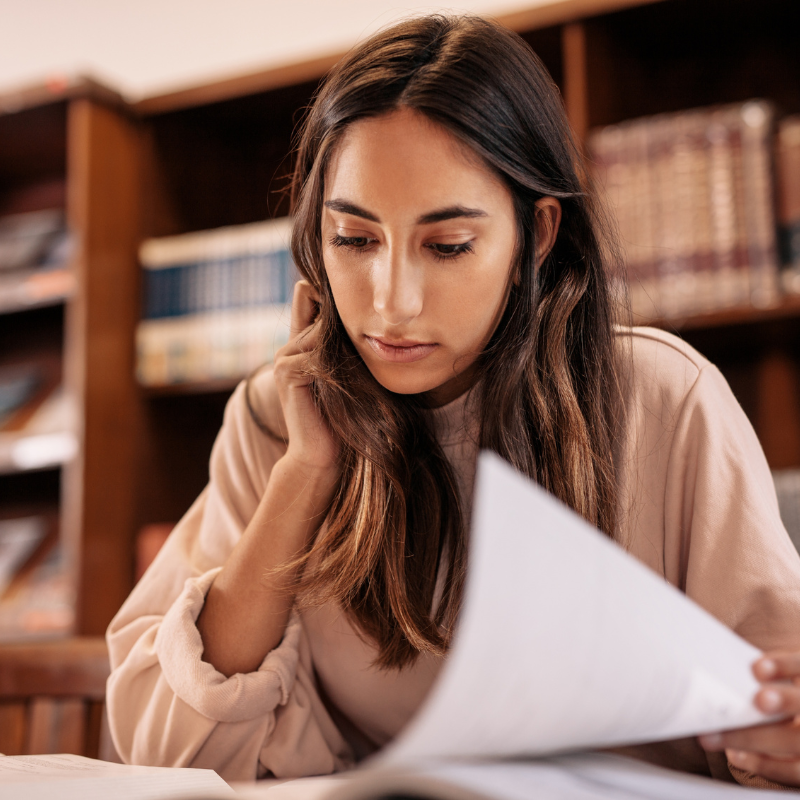 woman at a desk with paperwork for family court order modification attorney in Pinellas County